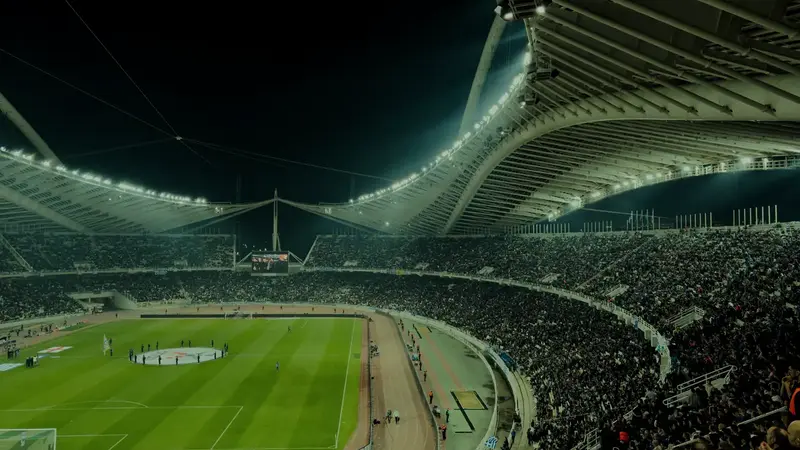 A football stadium under floodlights