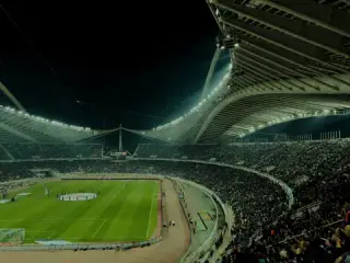 A football stadium under floodlights